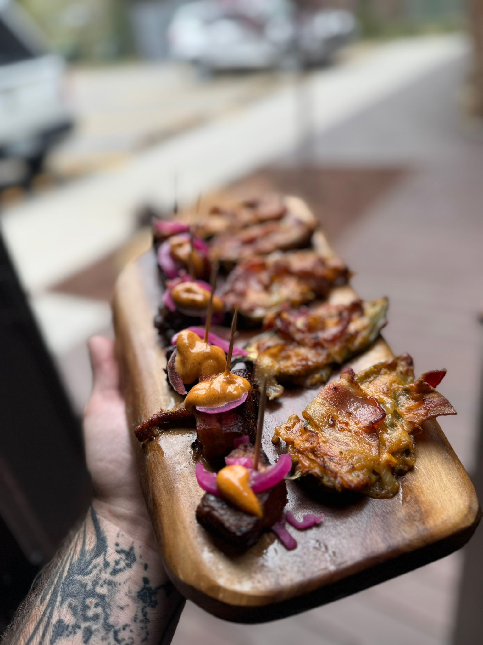 Catering skewer appetizers on a wooden board